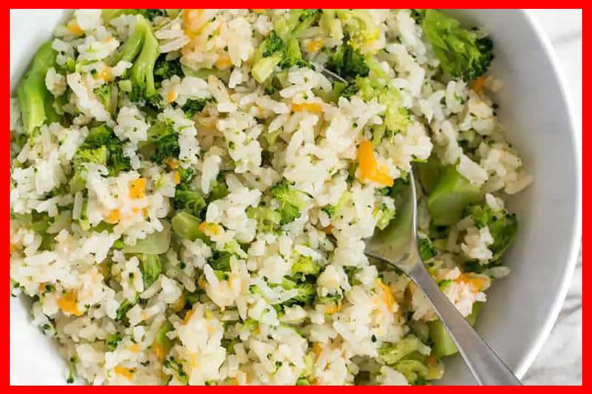 30-Minute Healthy Broccoli Cheese Rice in a plate with a silver spoon in it.