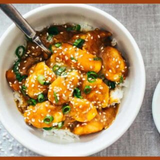 A picture of 30-Minute Sesame Mango Chicken Teriyaki in a white plate with a silver spoon in it.