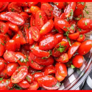 A picture of 5-Ingredient Marinated Tomatoes in a glass bowl.