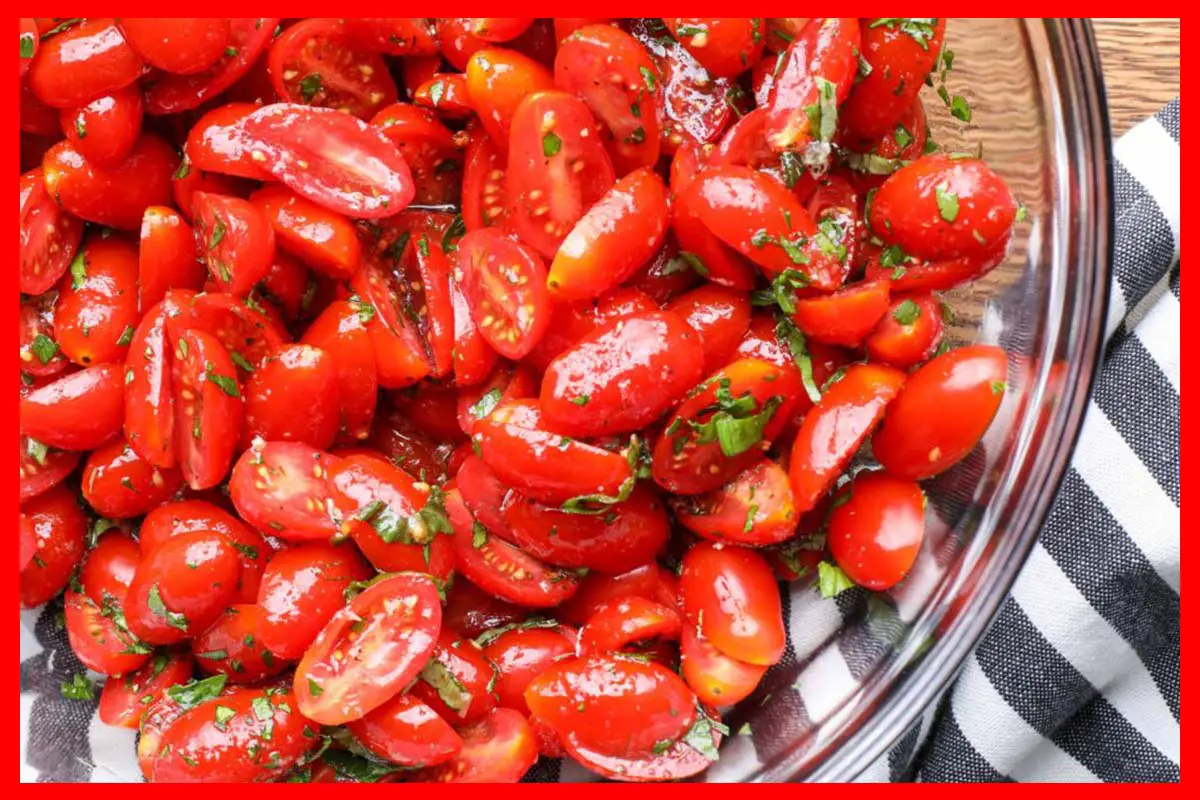 A picture of 5-Ingredient Marinated Tomatoes in a glass bowl.