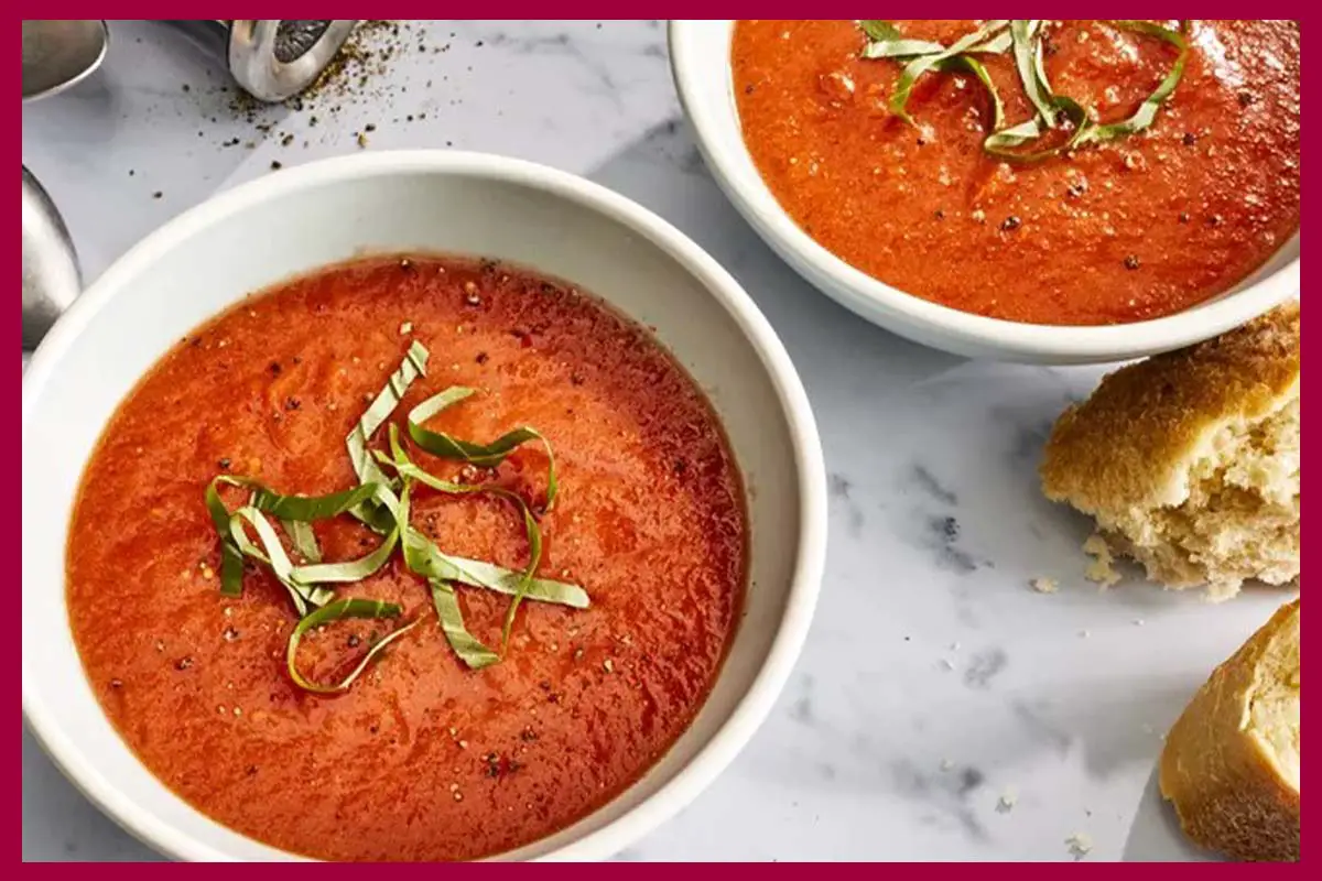 2 plates of 5-Ingredient Tomato Soup on a white table.