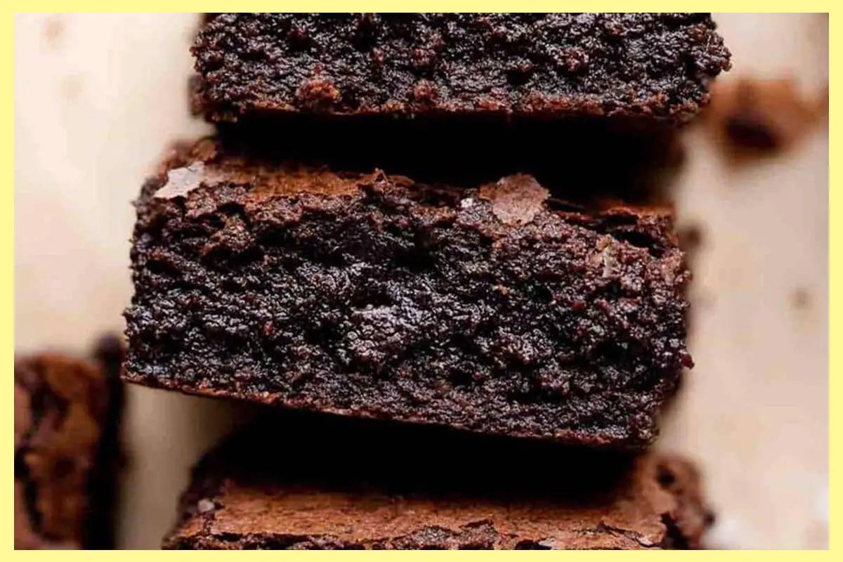 A picture of 3 6-Ingredient Espresso Brownies stacked on top of each other.