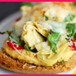 A picture of Artichoke And Red Pepper Melt on a white plate.