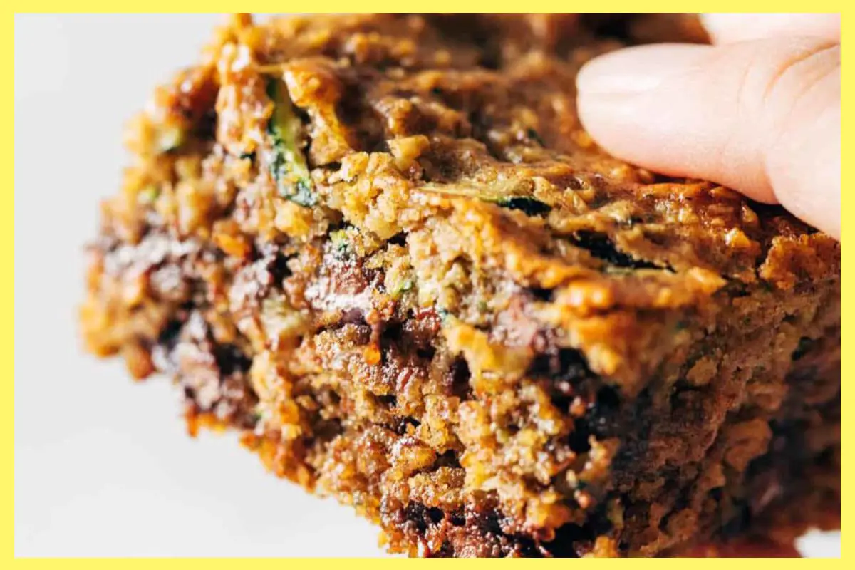 A picture of A person holding the delicious Almond Butter Chocolate Chip Zucchini Bars