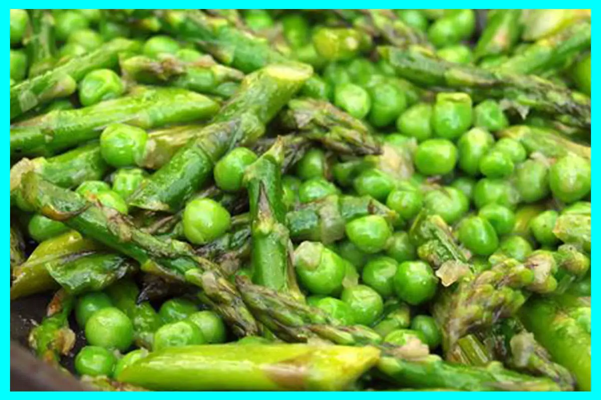 A picture of Asparagus And Pea Saute in a bowl. It looks very delicious.