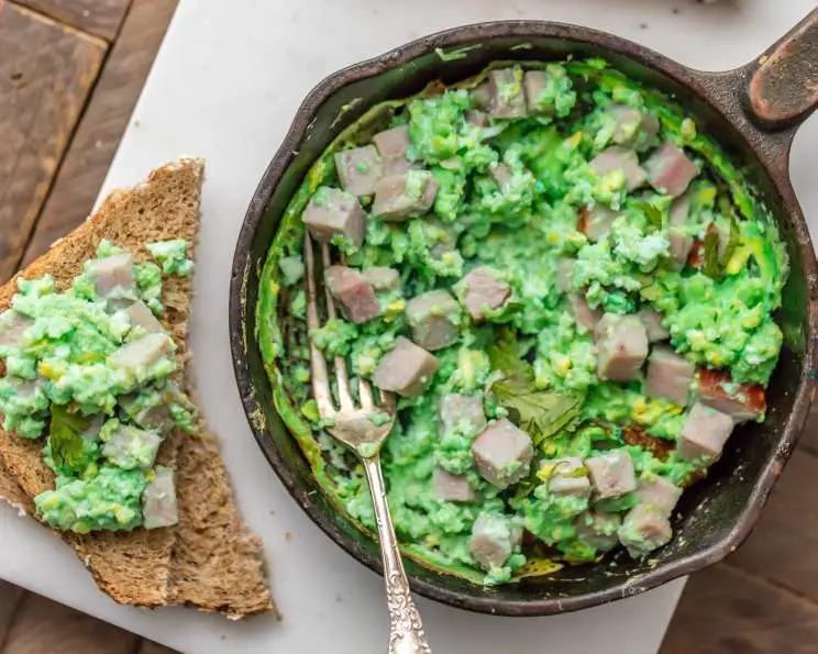 Green Eggs And Ham on a plate with a fork in it