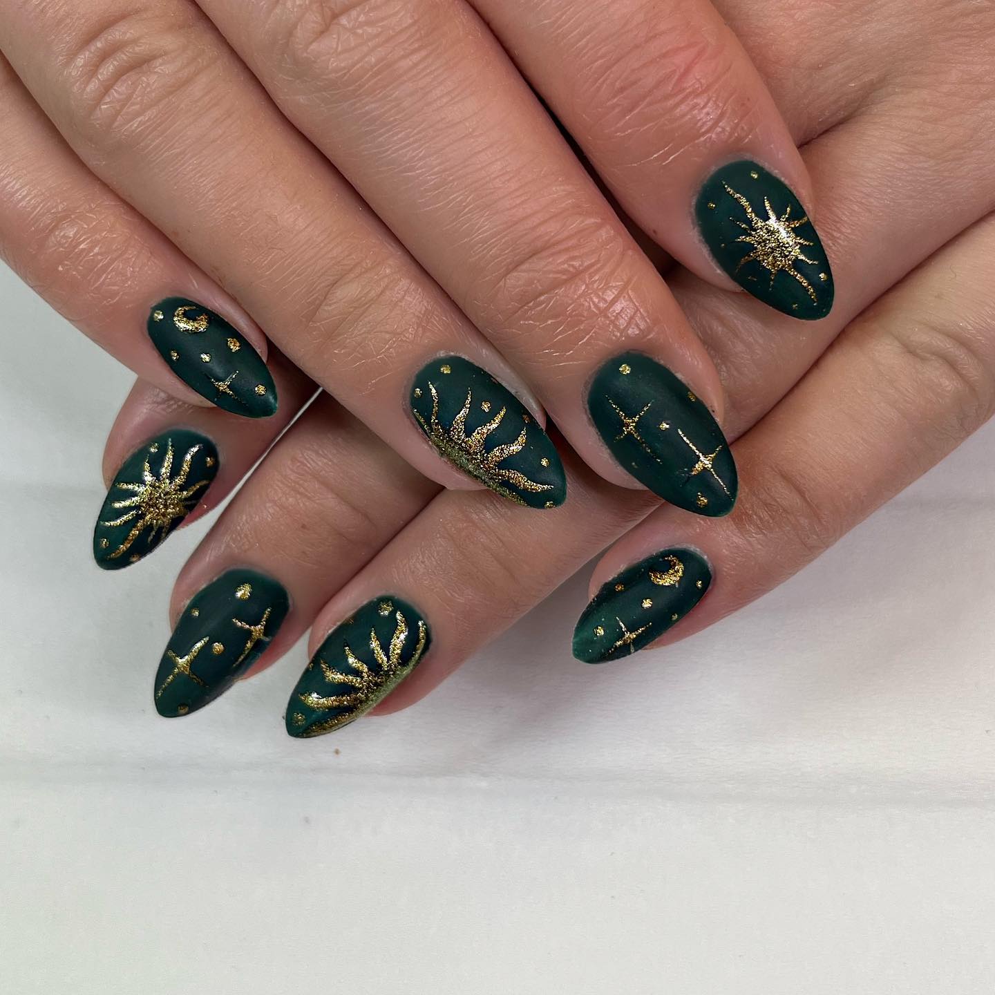 Dark Green Nails with Sun, Moon, and Stars