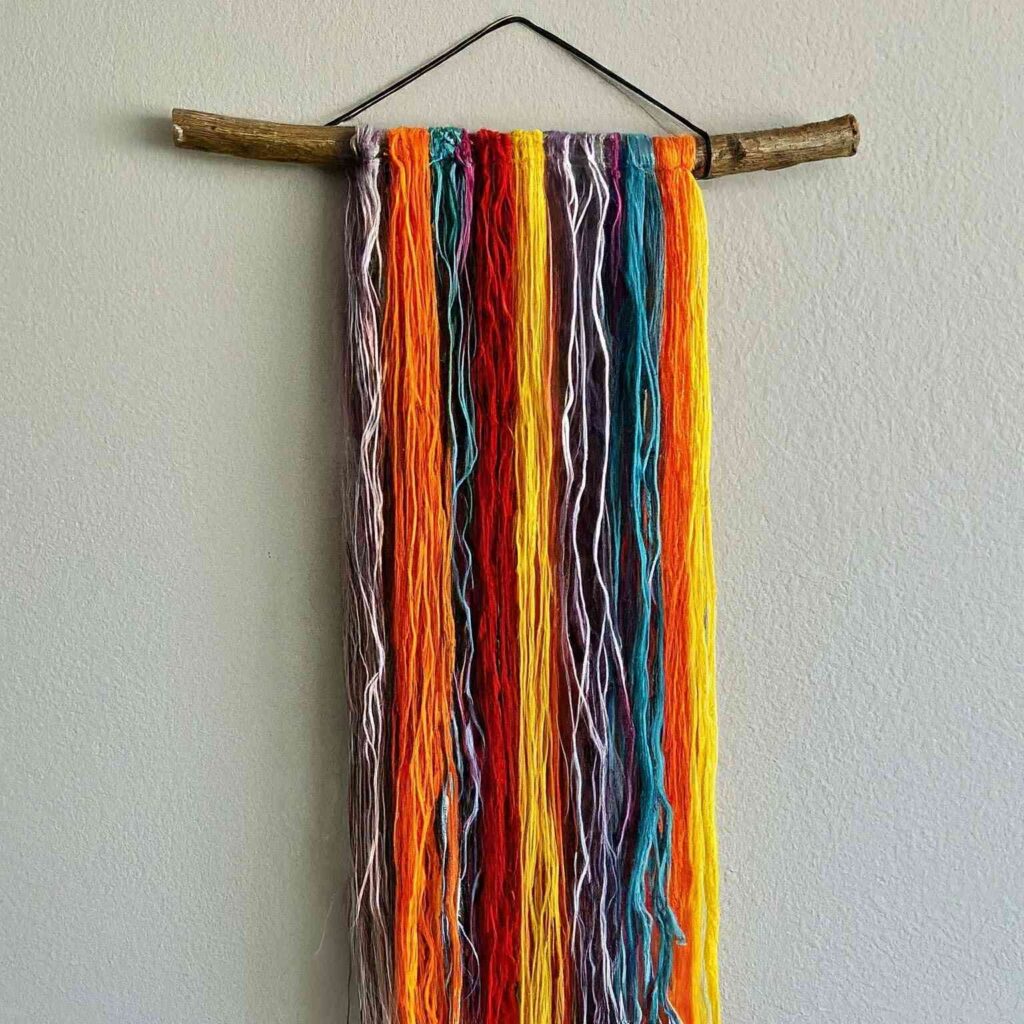 Yarn Wall Hanging with Pom Poms