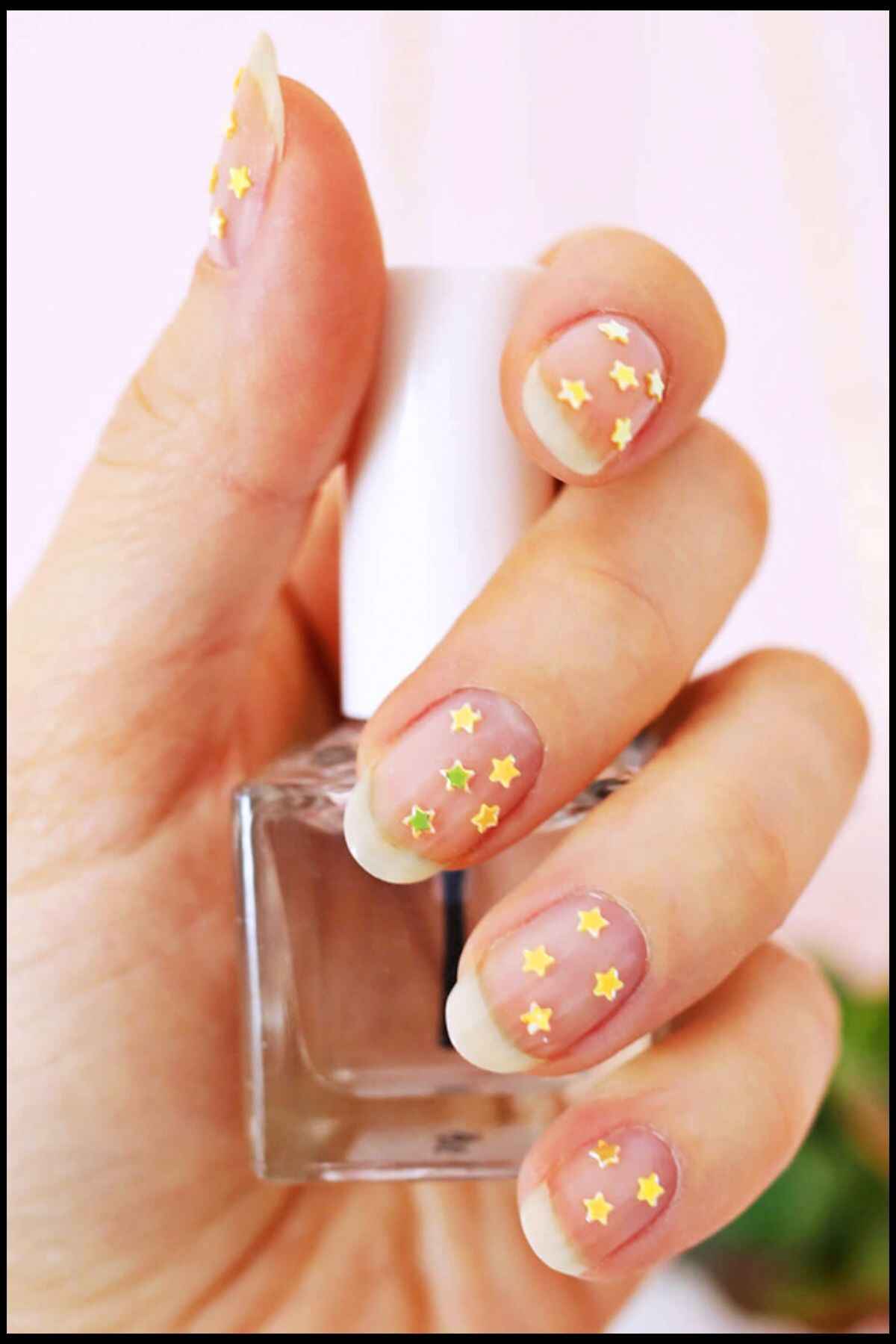 Gold Stars Nail Design